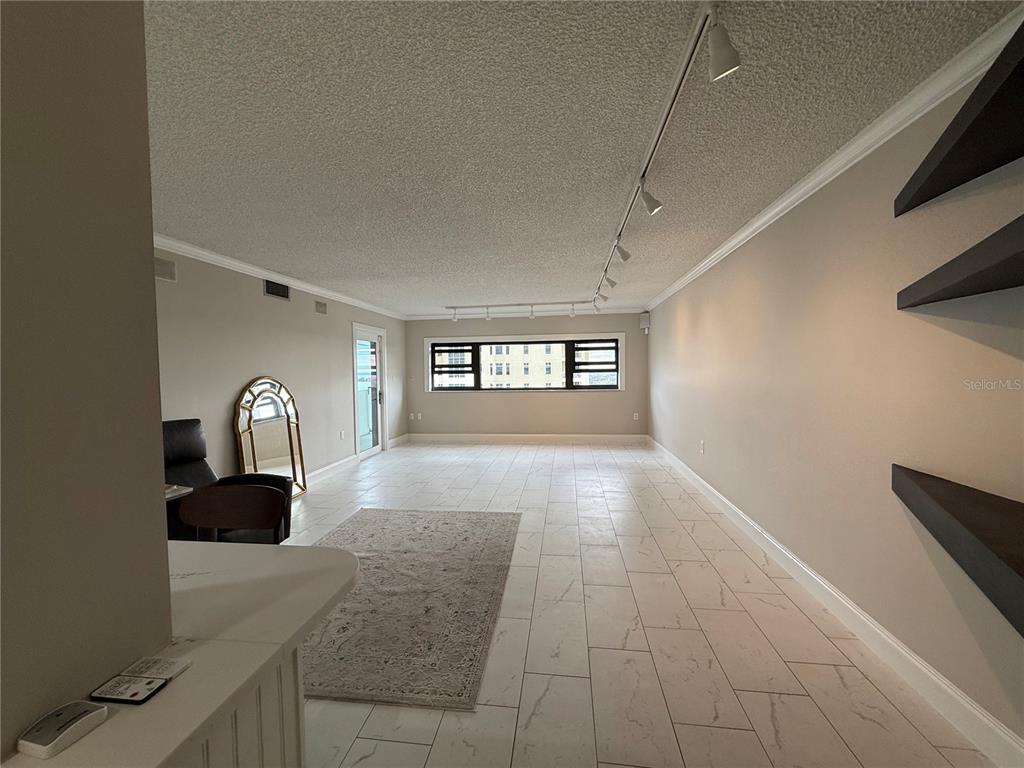 4141 Bayshore Boulevard, Unit 1203 Tampa, FL 33611 - Photo 4 of 16 a view of a livingroom with wooden floor and windows