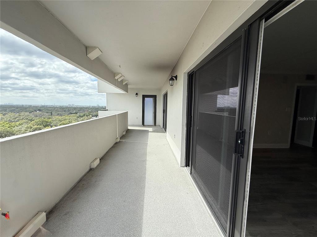 4141 Bayshore Boulevard, Unit 1203 Tampa, FL 33611 - Photo 9 of 16 a view of hallway with stairs