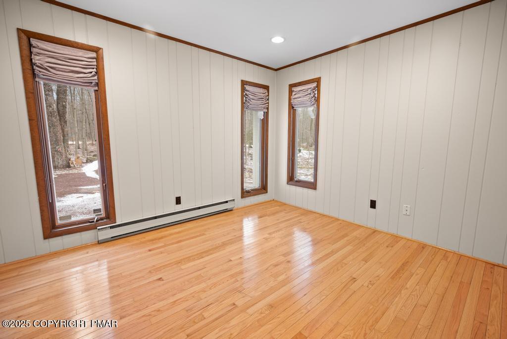 117 Outpost Way Pocono Pines, PA 18350 - Photo 11 of 36 a view of an empty room with wooden floor and a window