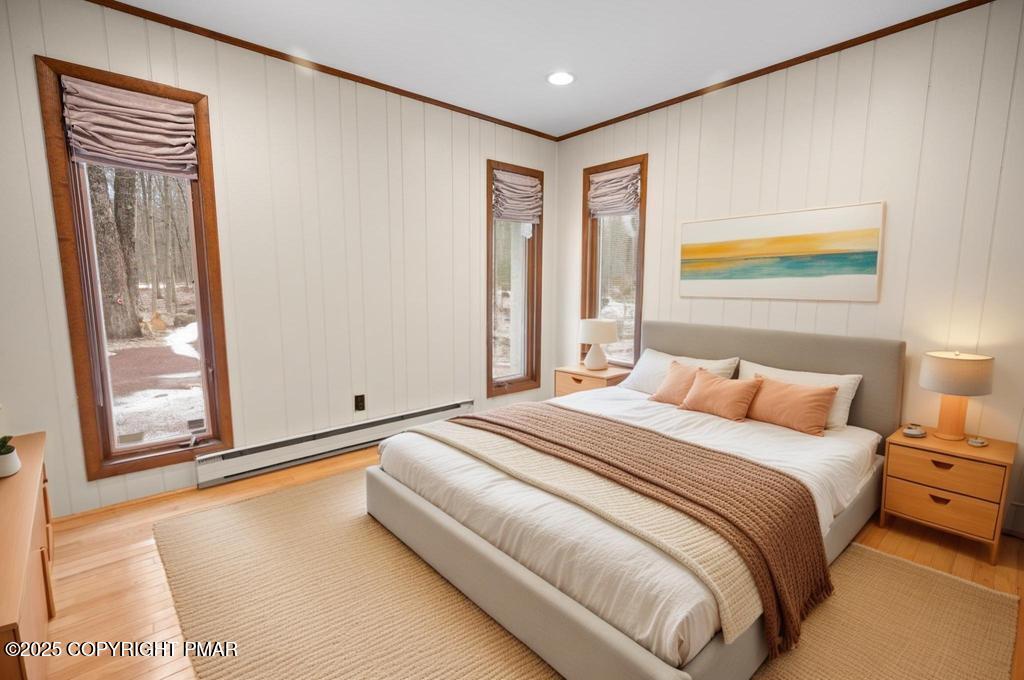 117 Outpost Way Pocono Pines, PA 18350 - Photo 12 of 36 a bedroom with a bed and wooden floor