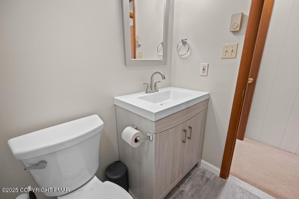 117 Outpost Way Pocono Pines, PA 18350 - Photo 15 of 36 a bathroom with a sink toilet and mirror
