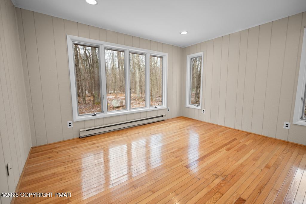 117 Outpost Way Pocono Pines, PA 18350 - Photo 16 of 36 a view of an empty room with wooden floor and a window