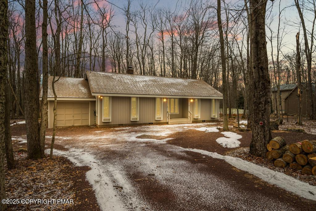 117 Outpost Way Pocono Pines, PA 18350 - Photo 30 of 36 a view of a house with a yard and garage
