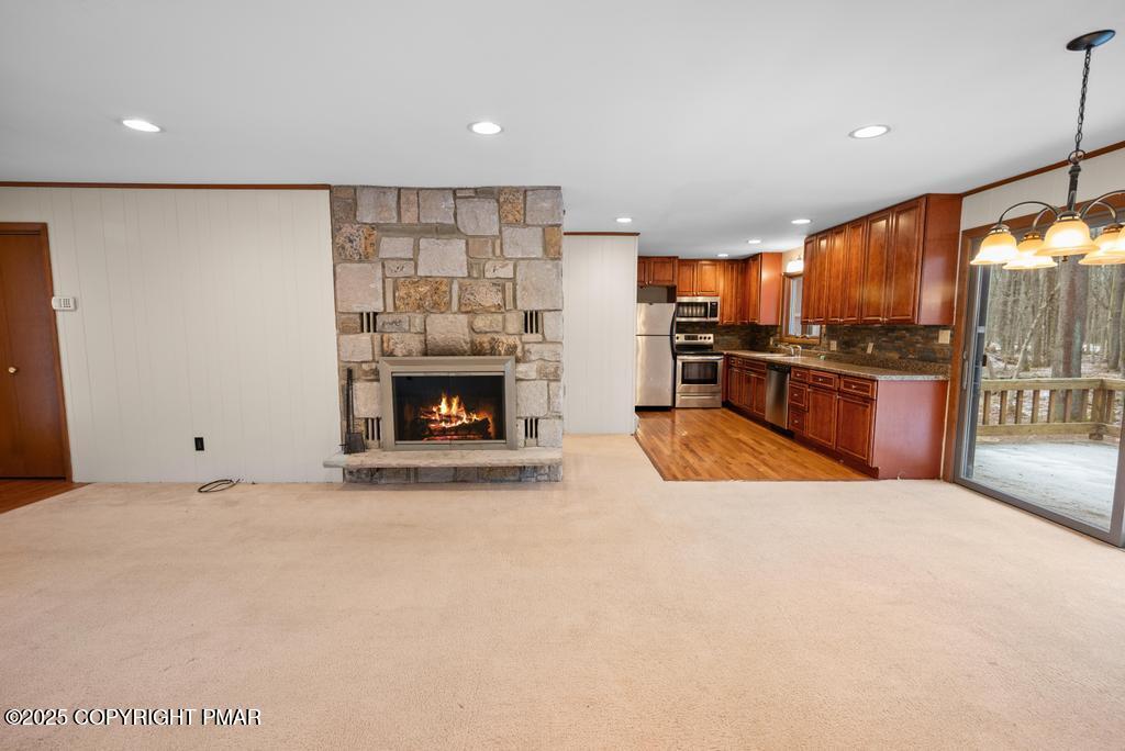 117 Outpost Way Pocono Pines, PA 18350 - Photo 4 of 36 a large kitchen with stainless steel appliances a large counter top