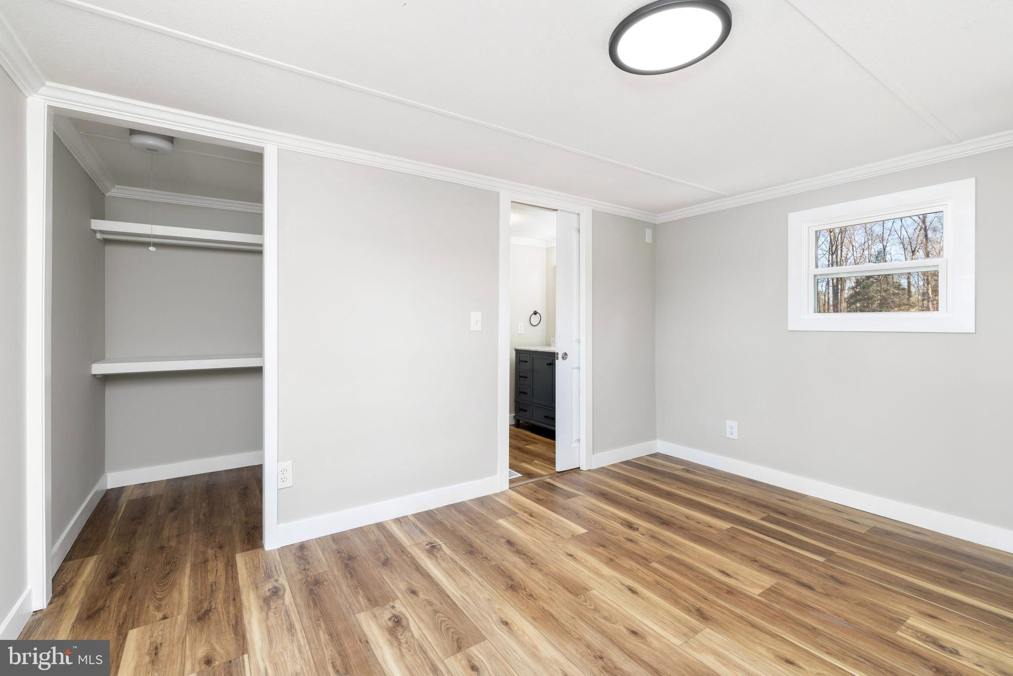 870 South Hill Road Brodnax, VA 23920 - Photo 30 of 39 a view of a room with wooden floor and closet