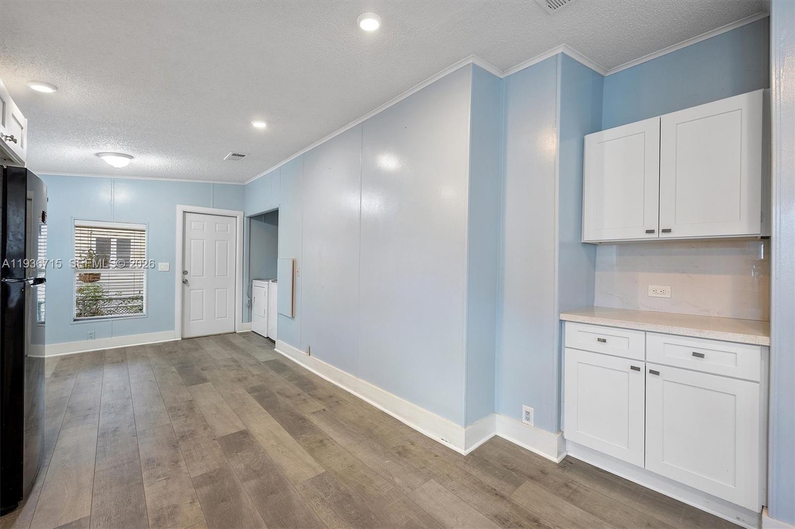 19800 Southwest 180th Avenue Miami, FL 33187 - Photo 19 of 36 a view of an empty room with wooden floor