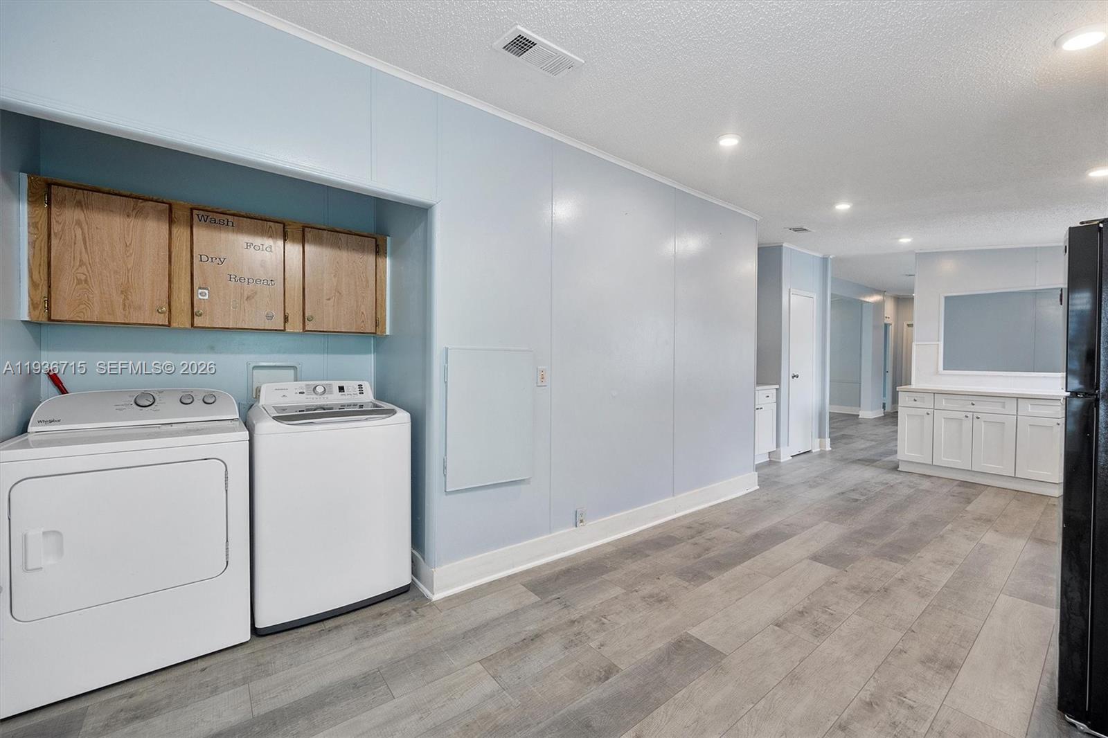 19800 Southwest 180th Avenue Miami, FL 33187 - Photo 20 of 36 a view of a storage & utility room with closet dryer and washer