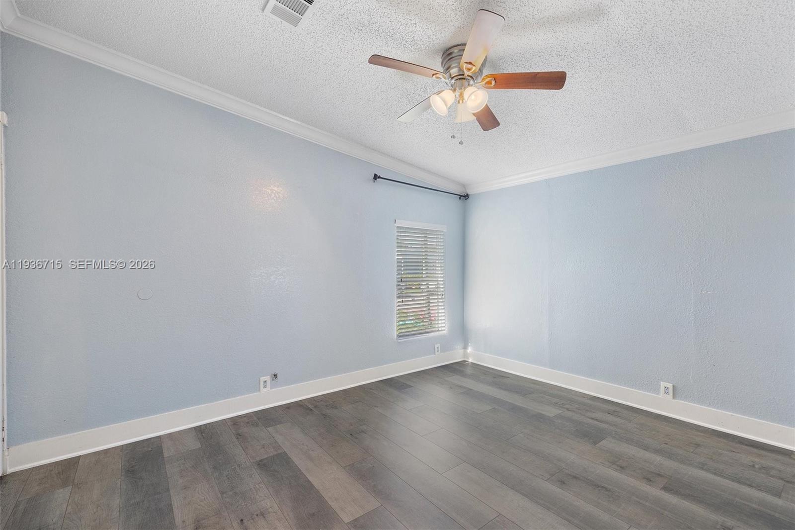 19800 Southwest 180th Avenue Miami, FL 33187 - Photo 26 of 36 wooden floor in an empty room with a window