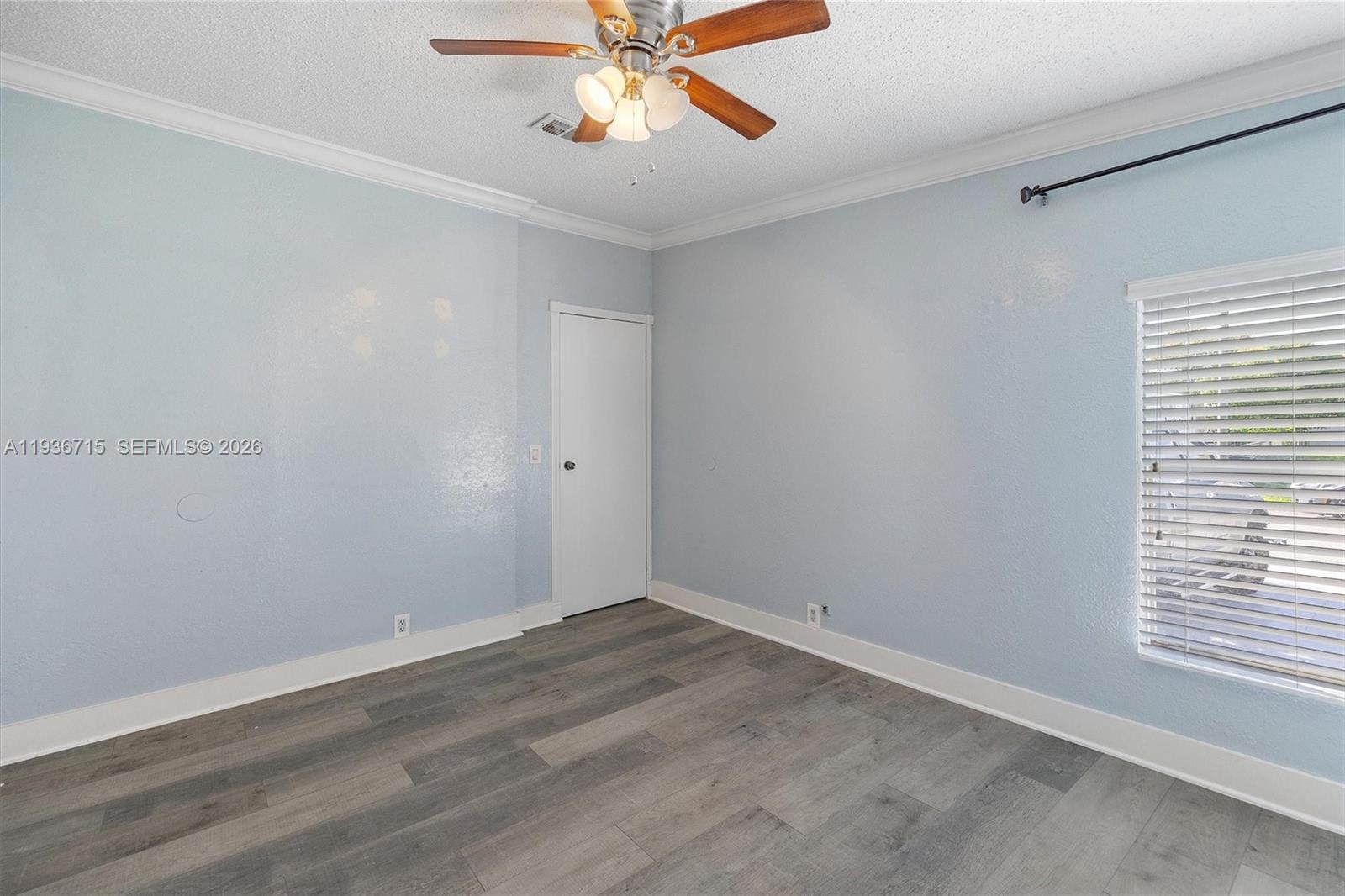 19800 Southwest 180th Avenue Miami, FL 33187 - Photo 27 of 36 wooden floor in an empty room with a window