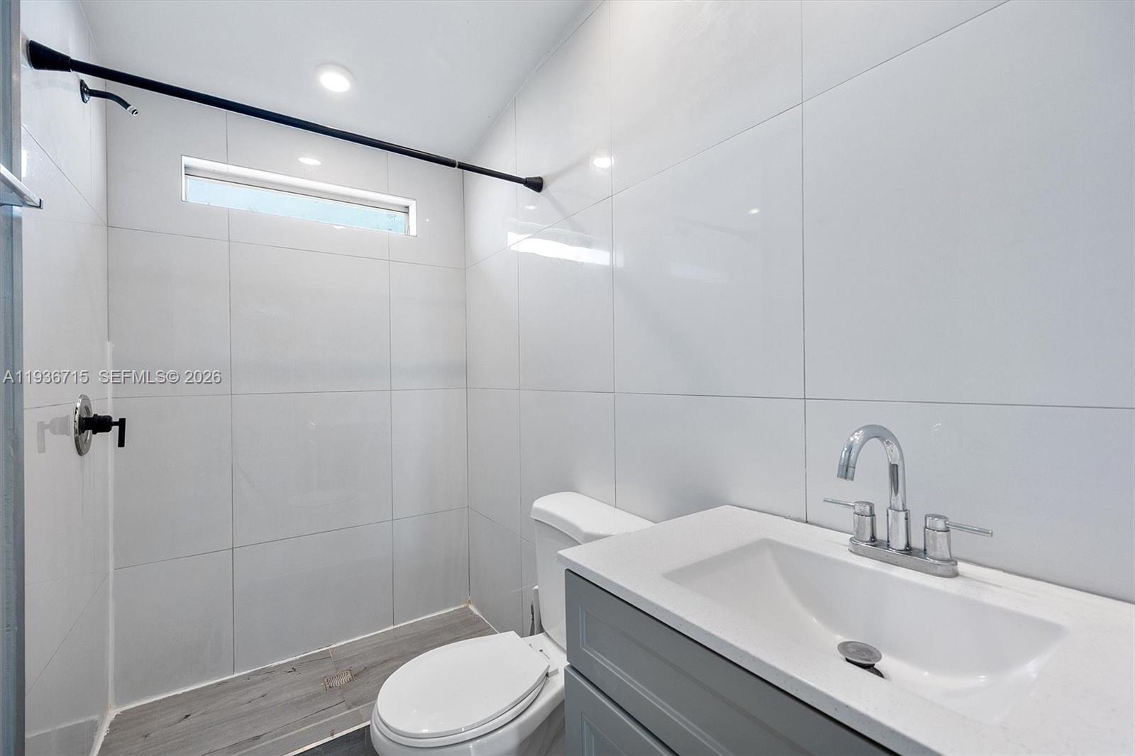 19800 Southwest 180th Avenue Miami, FL 33187 - Photo 30 of 36 a bathroom with a sink toilet and shower