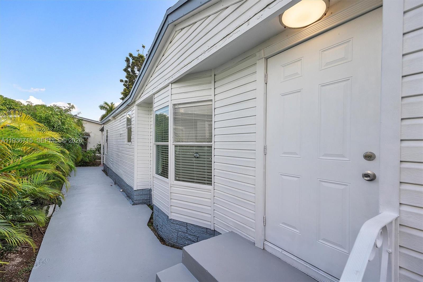 19800 Southwest 180th Avenue Miami, FL 33187 - Photo 32 of 36 a view of a house with a backyard