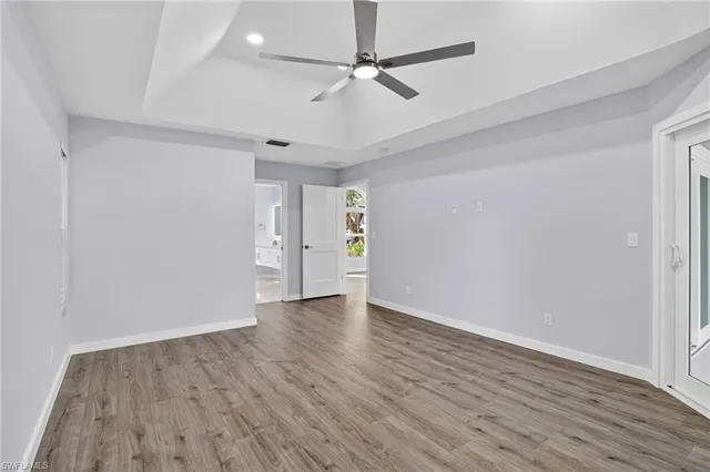 a bathroom with a granite countertop double vanity sink a mirror and a