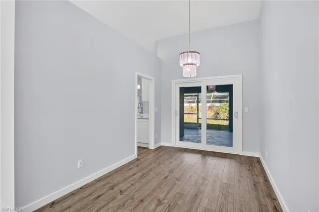 a view of an entryway with wooden floor