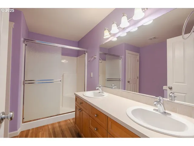 a bathroom with a sink a vanity and a mirror
