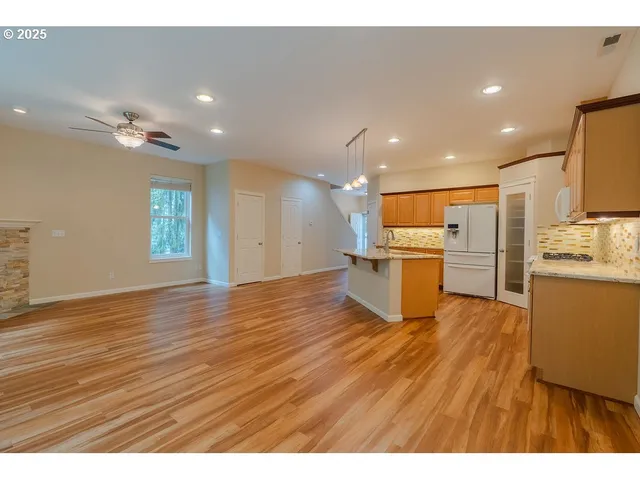 a view of kitchen with wooden floor
