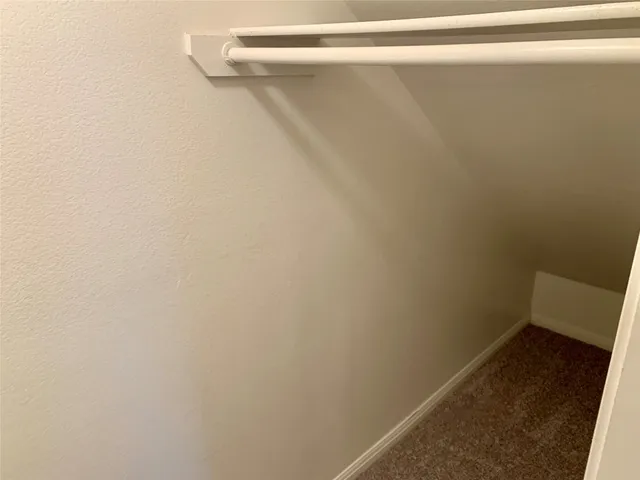 a kitchen with a stove and a refrigerator