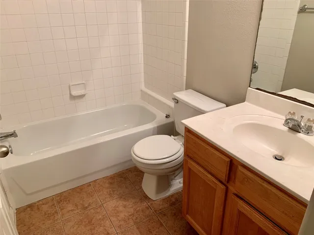 an empty room with windows and entrance