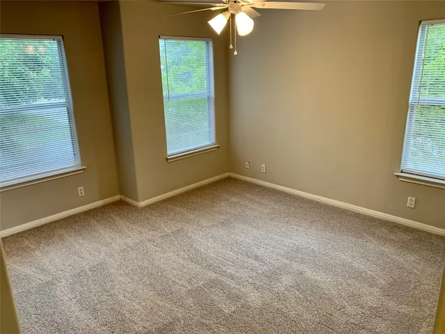 a view of an empty room with a bathroom