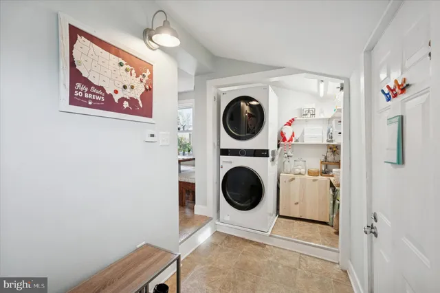 a view of a hallway with washer and dryer