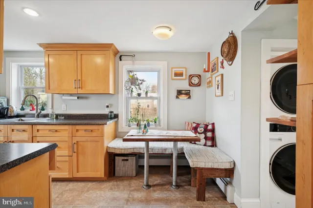 a kitchen with a table and chairs in it