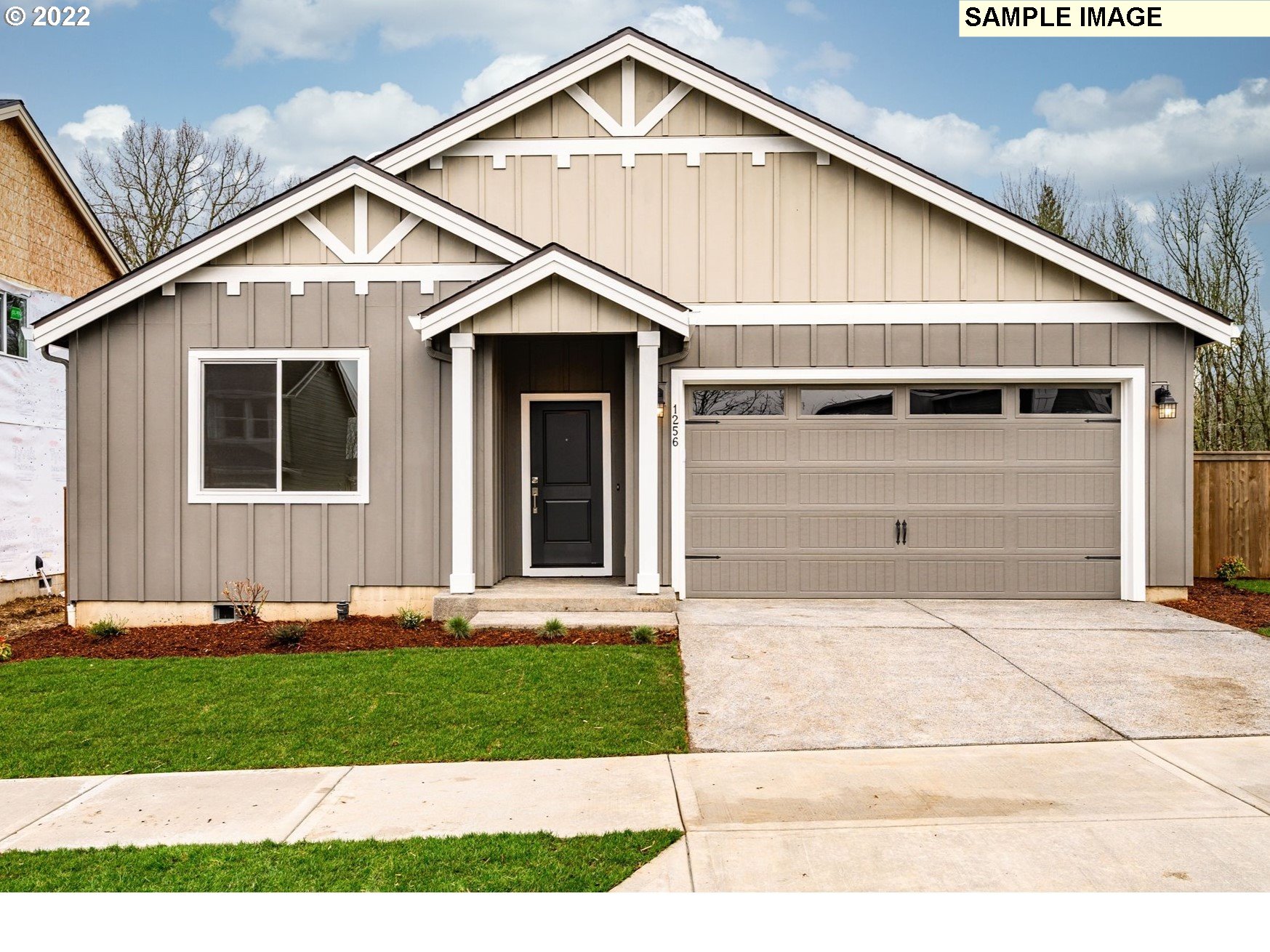 8847 North 5th Street, Unit LT61 Ridgefield, WA 98642 - Photo 1 of 31 a front view of a house with a yard and garage