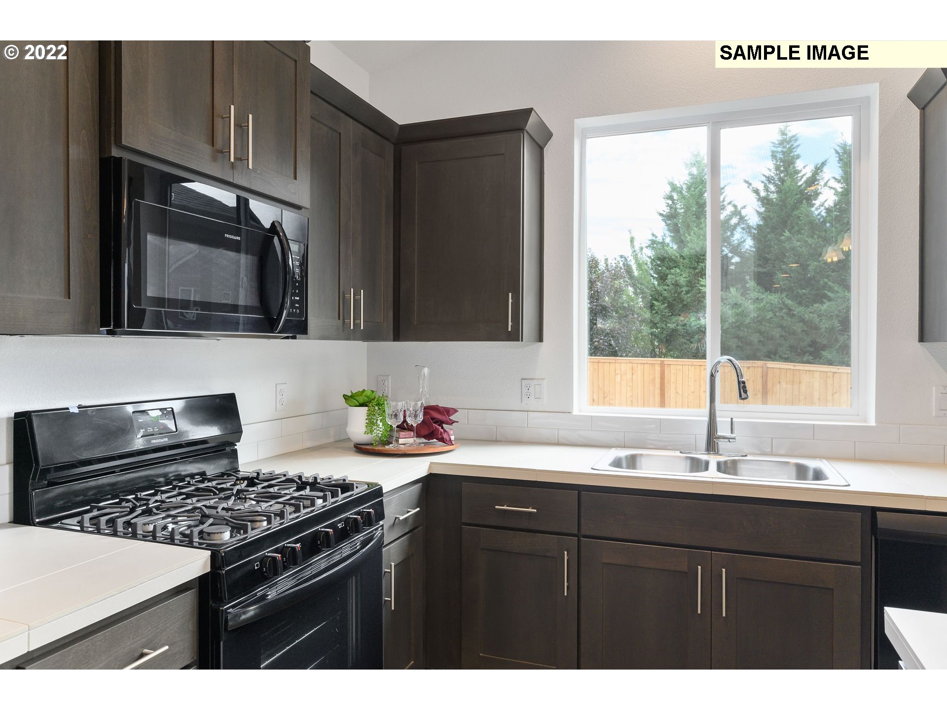 8847 North 5th Street, Unit LT61 Ridgefield, WA 98642 - Photo 17 of 31 a kitchen with a sink and a stove