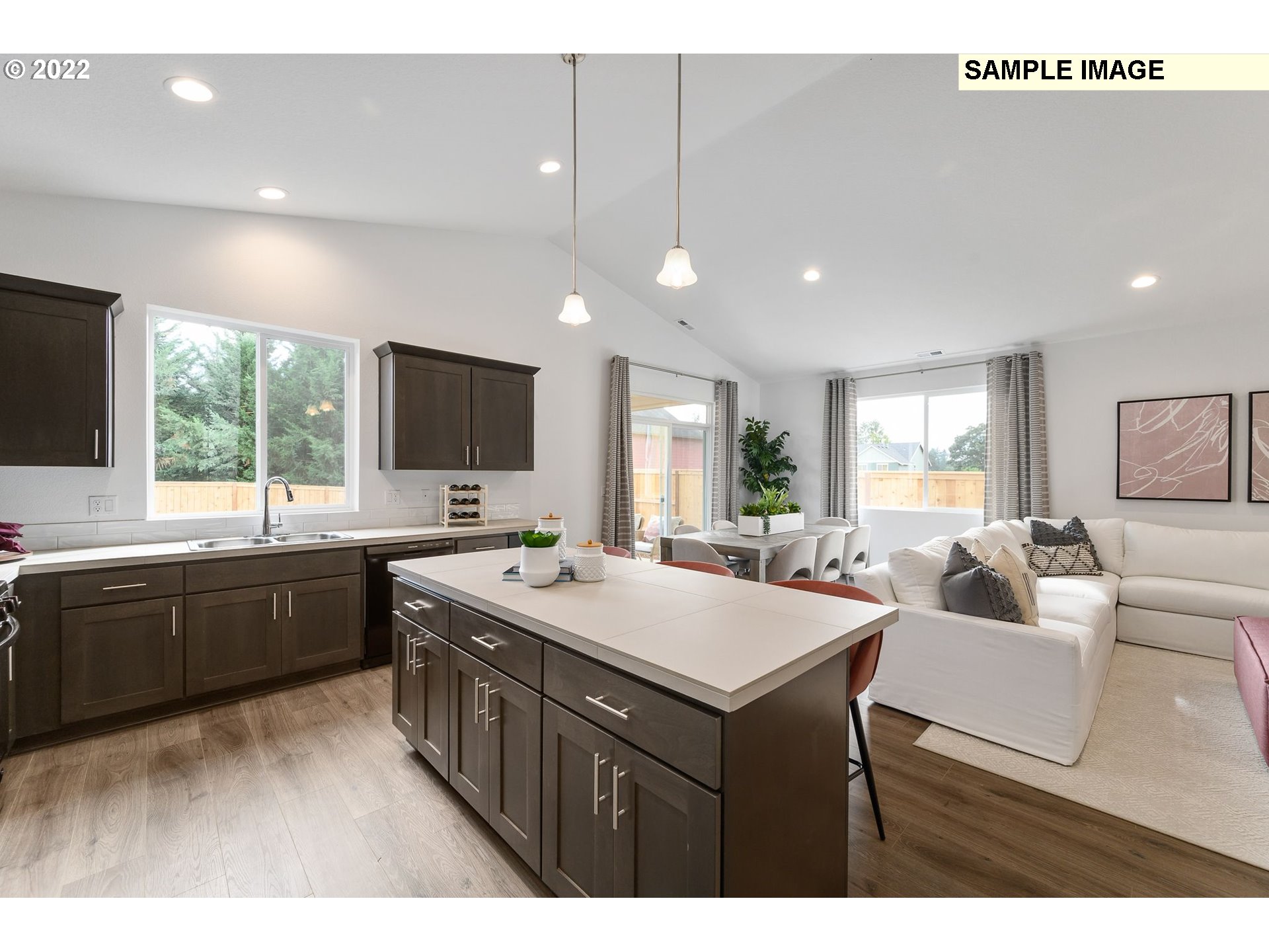 8847 North 5th Street, Unit LT61 Ridgefield, WA 98642 - Photo 20 of 31 a large kitchen with kitchen island a sink stainless steel appliances and furniture