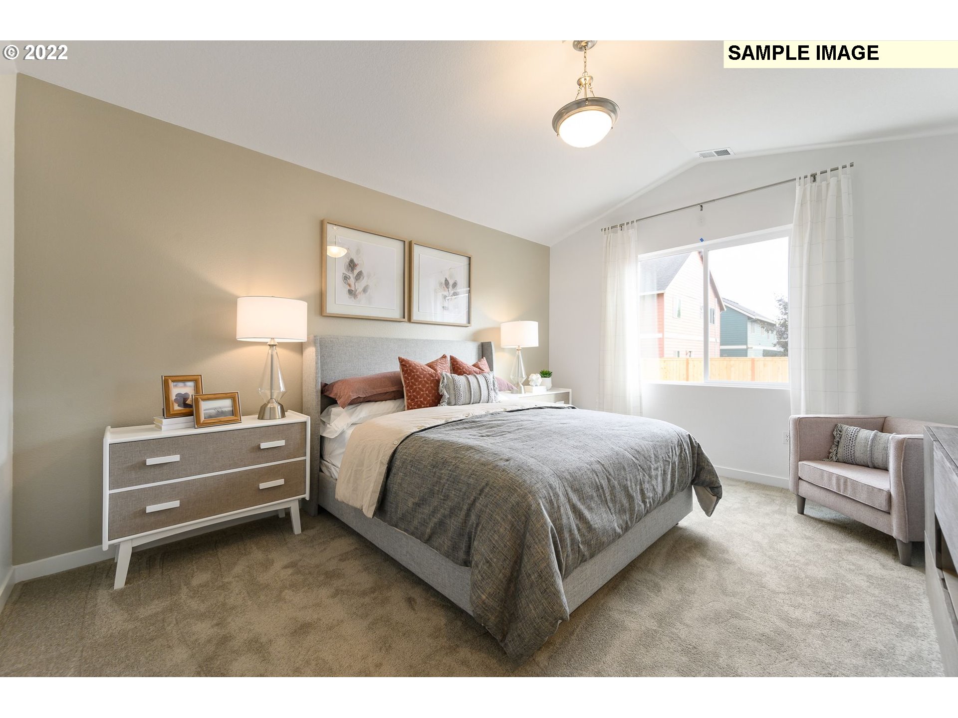 8847 North 5th Street, Unit LT61 Ridgefield, WA 98642 - Photo 22 of 31 a spacious bedroom with a bed and a couch