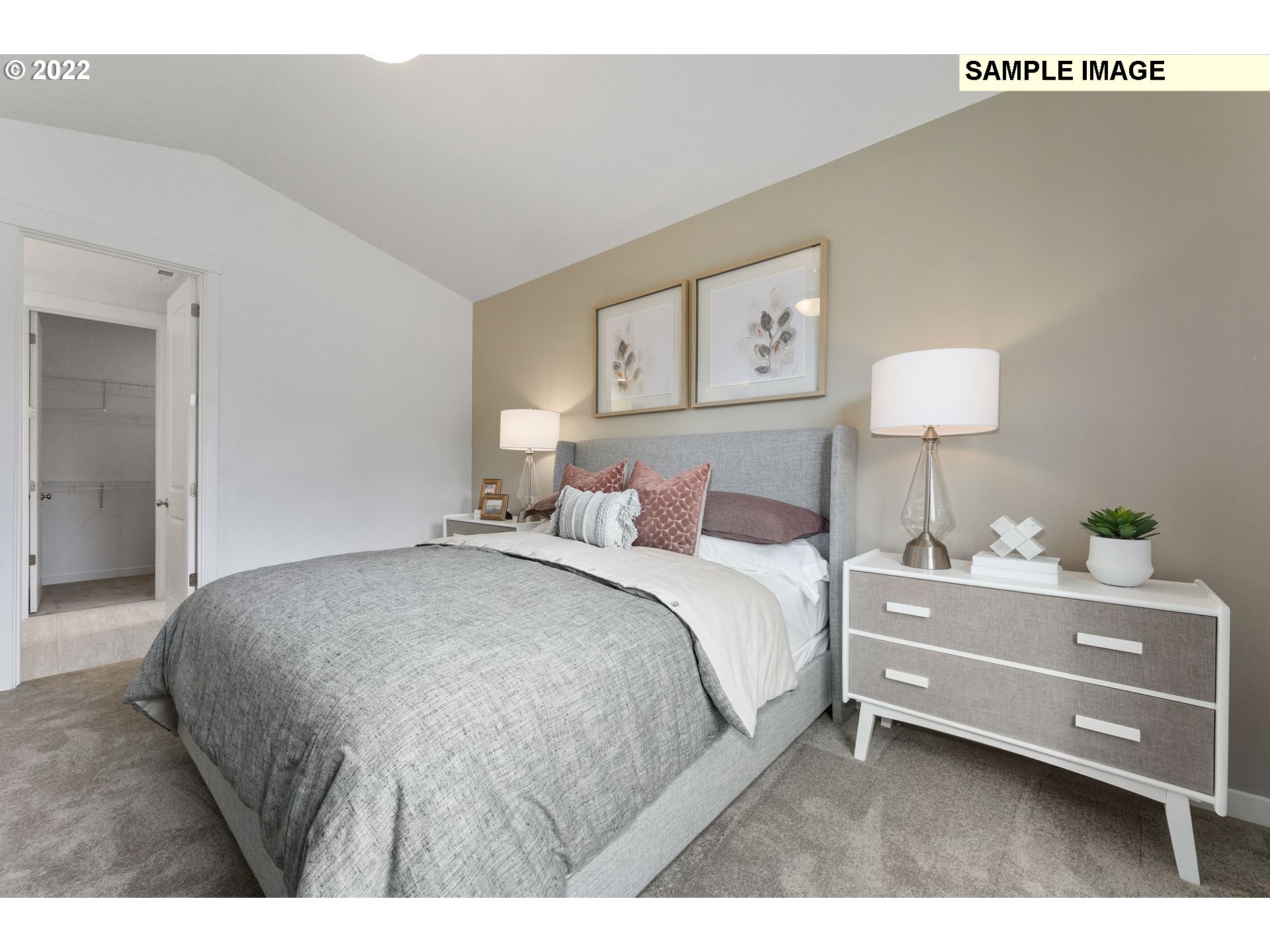 8847 North 5th Street, Unit LT61 Ridgefield, WA 98642 - Photo 23 of 31 a bedroom with a bed and a lamp on dresser