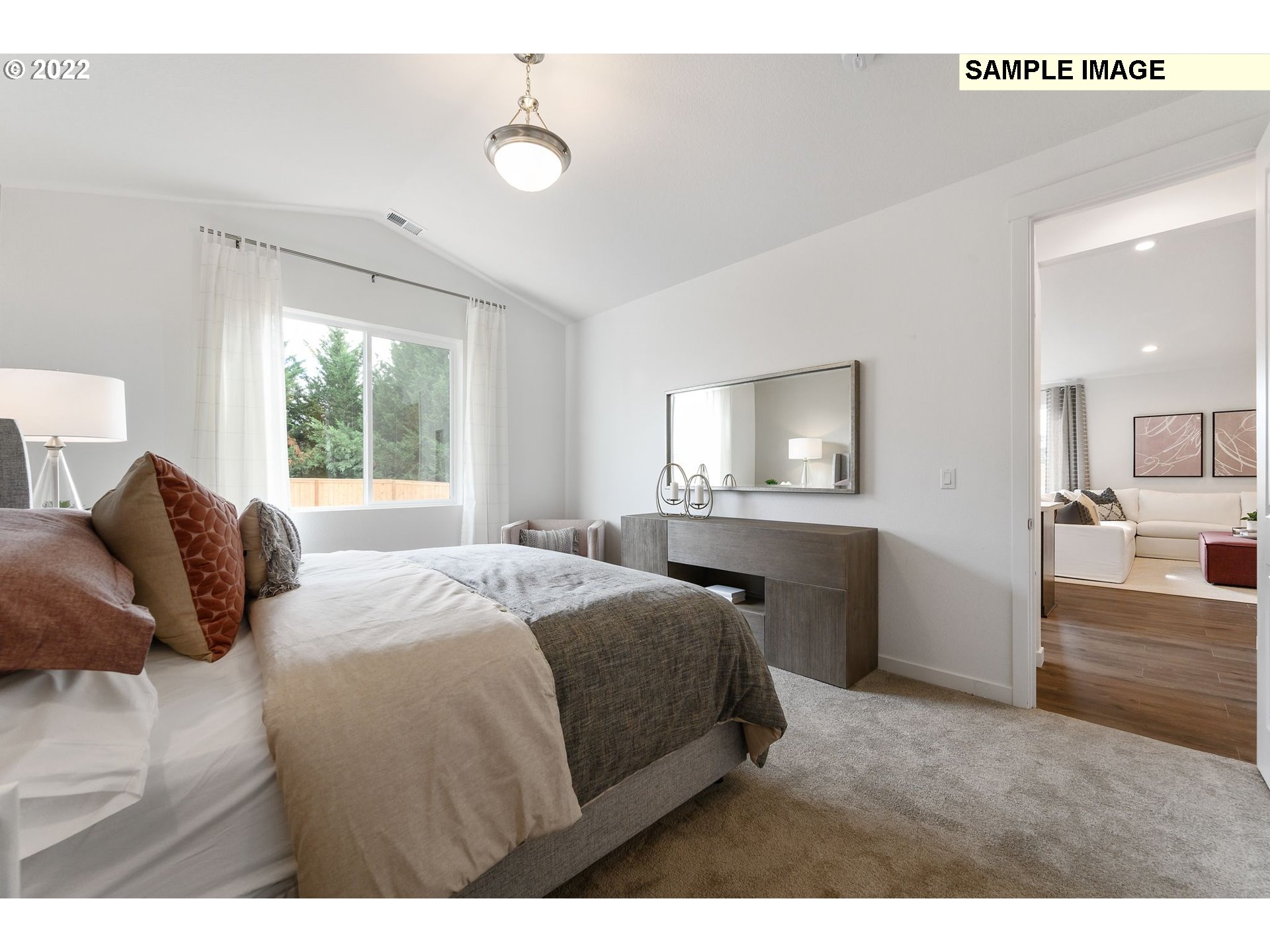 8847 North 5th Street, Unit LT61 Ridgefield, WA 98642 - Photo 24 of 31 a bedroom with a bed and a lamp