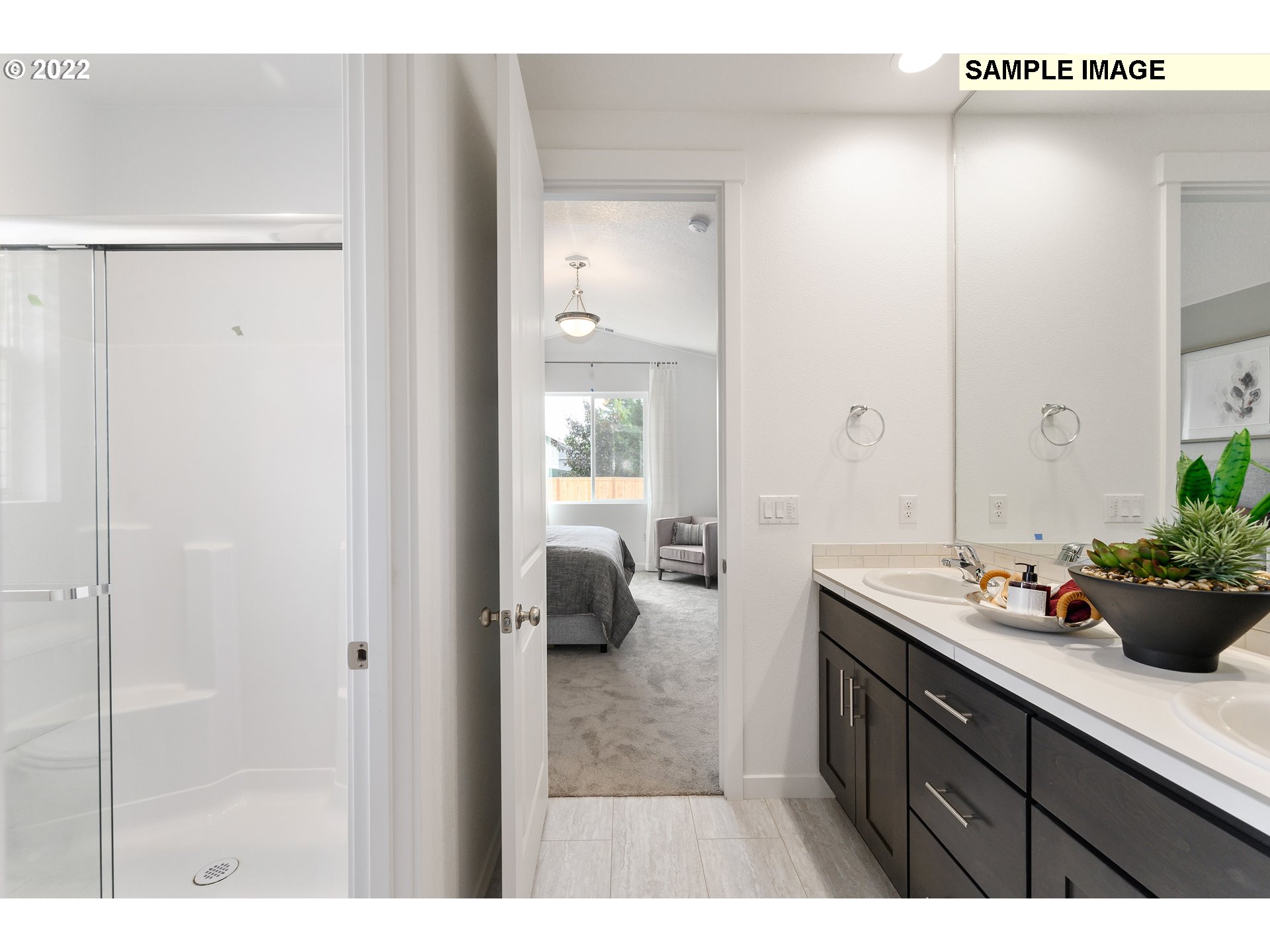 8847 North 5th Street, Unit LT61 Ridgefield, WA 98642 - Photo 27 of 31 a bathroom with a sink a mirror and a shower