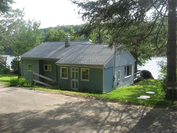336 Mashapaug Road Holland, MA 01521 - Photo 1 of 17 a view of a yard in front of house