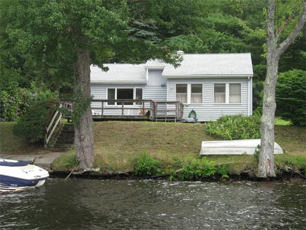 336 Mashapaug Road Holland, MA 01521 - Photo 2 of 17 a front view of a house with a yard