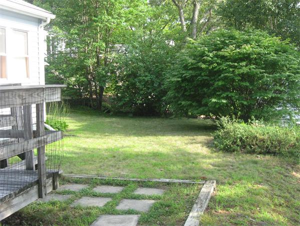 336 Mashapaug Road Holland, MA 01521 - Photo 6 of 17 a backyard of a house with lots of green space