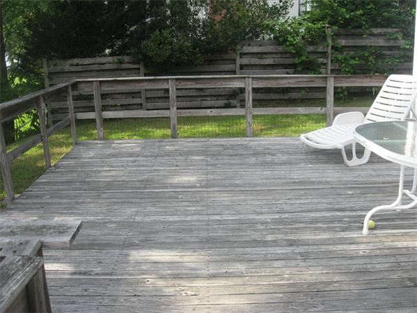 336 Mashapaug Road Holland, MA 01521 - Photo 7 of 17 a view of a deck with couches chairs and wooden floor