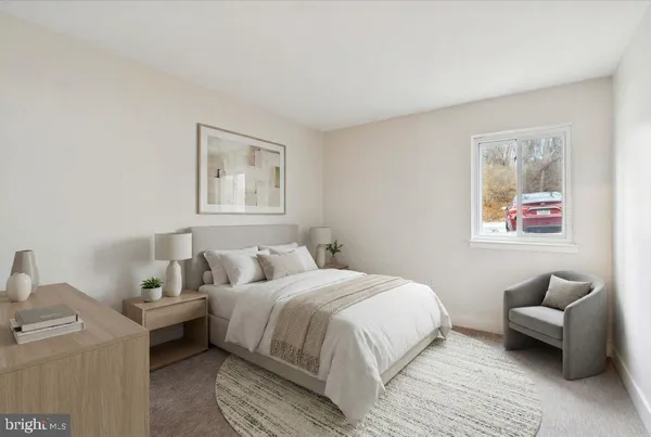 a bedroom with a bed and a couch