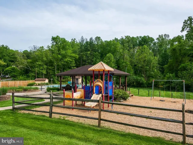 a view of park with an outdoor seating