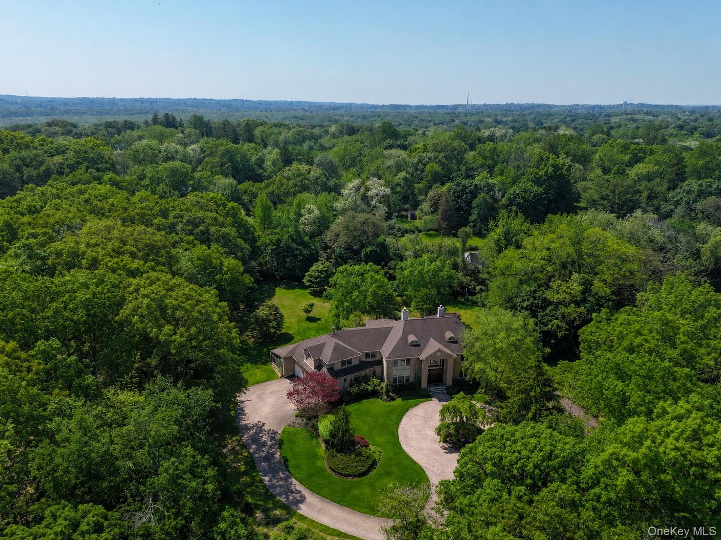 1 Springwood Path Syosset, NY 11791 - Photo 3 of 47 an aerial view of a house with mountain view
