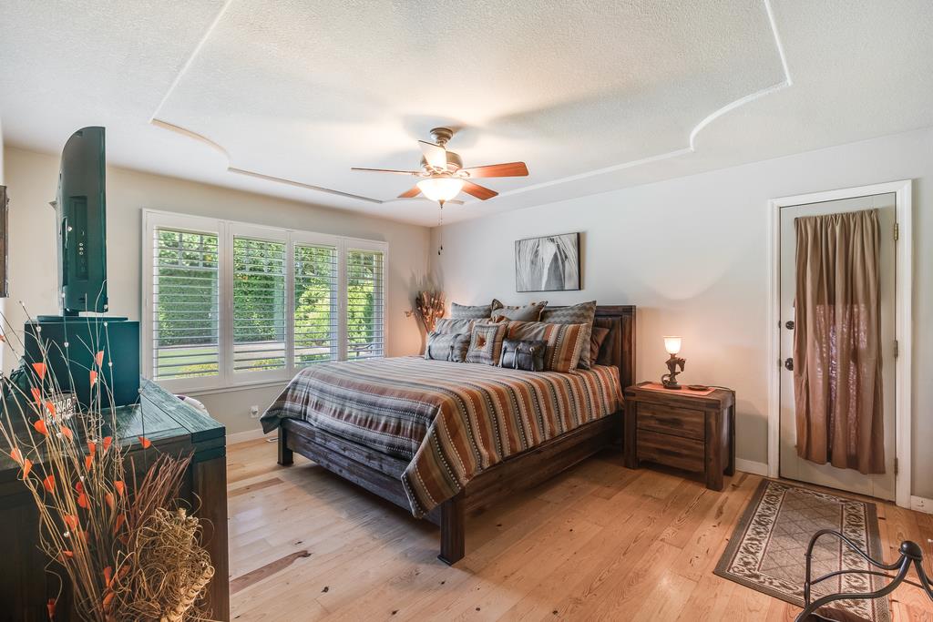 10640 La Corte Lane Gilroy, CA 95020 - Photo 12 of 29 a spacious bedroom with a bed and large windows