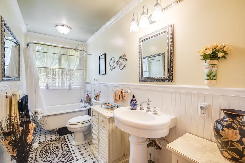 10640 La Corte Lane Gilroy, CA 95020 - Photo 19 of 29 a bathroom with a sink toilet a mirror and tub