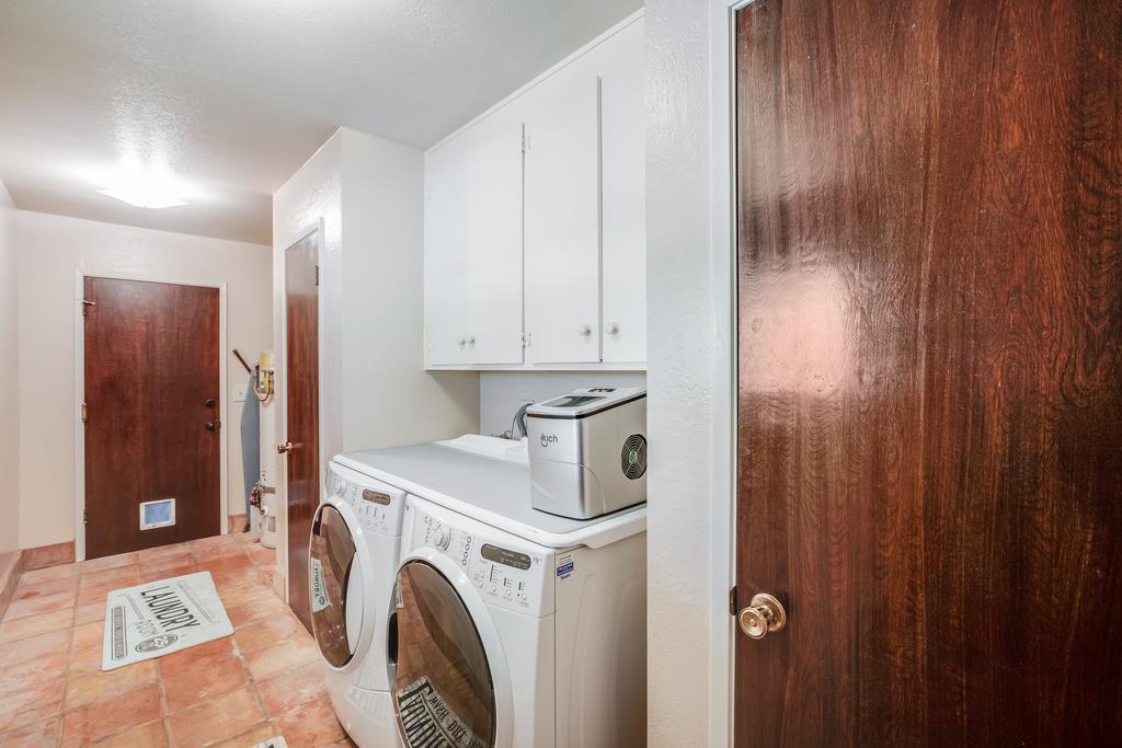10640 La Corte Lane Gilroy, CA 95020 - Photo 20 of 29 a view of storage and utility room with washer and dryer
