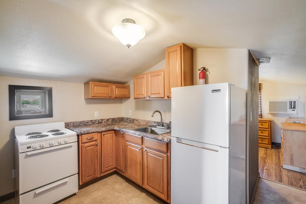 10640 La Corte Lane Gilroy, CA 95020 - Photo 25 of 29 a white refrigerator freezer sitting in a kitchen