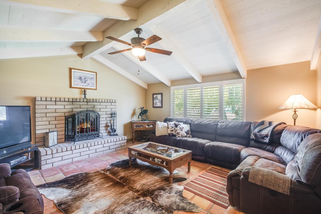 10640 La Corte Lane Gilroy, CA 95020 - Photo 10 of 29 a living room with furniture a window and a fireplace