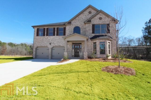 3703 Maple Hill Road, Unit 98 Lithonia, GA 30038 - Photo 1 of 1 a front view of a house with a yard