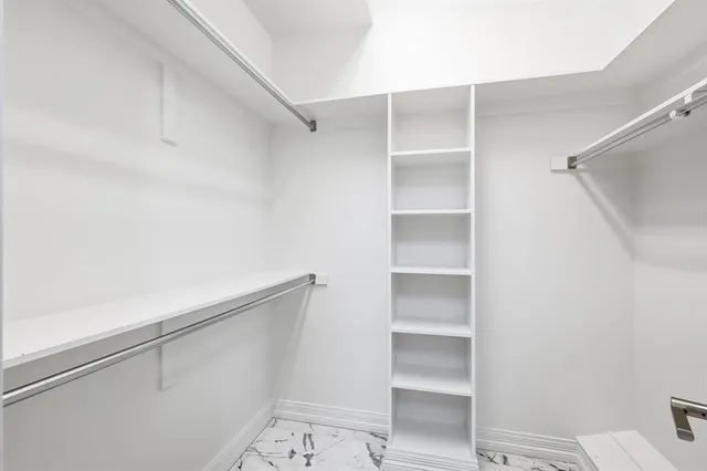 a view of an empty walk in closet