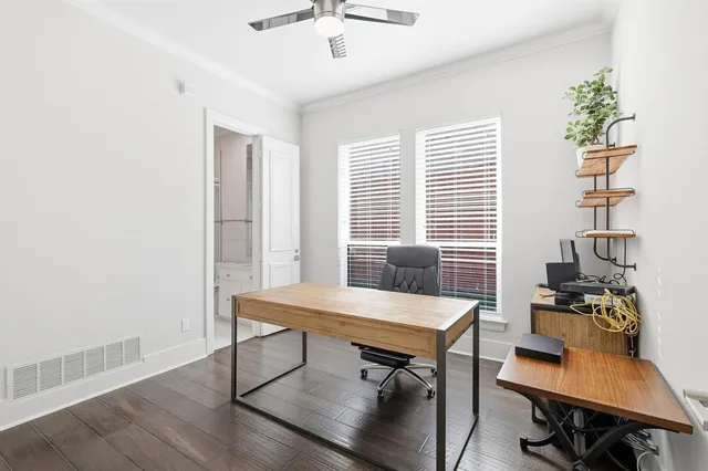 a workspace with furniture and a window