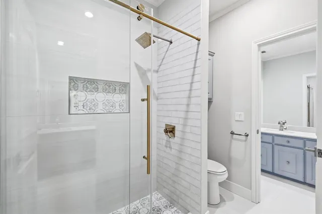 a bathroom with a toilet sink and shower