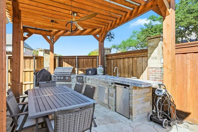 a view of a patio with a table and chairs