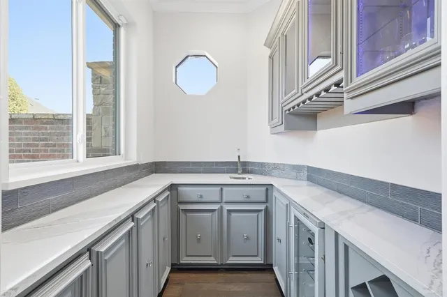 a kitchen that has a sink and a window