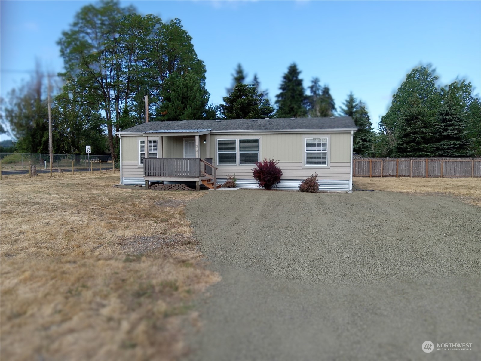 19721 Carper Road Southwest Rochester, WA 98579 - Photo 1 of 9 a view of a house with backyard and trees in the background